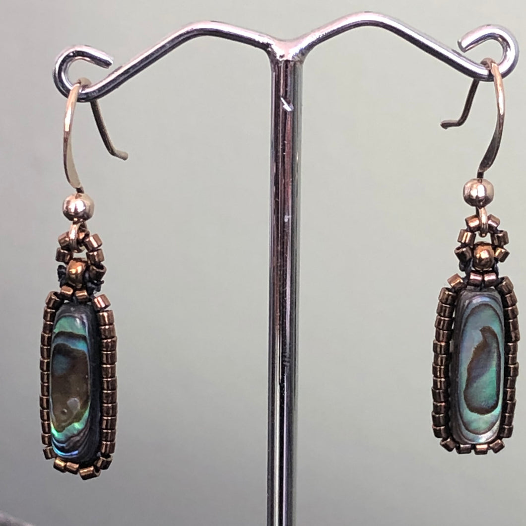 Paua earrings: Paua/Abalone shell flute surrounded by metallic glass micro-beads